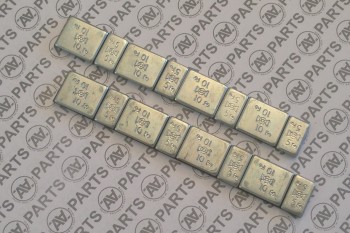 Peso correttore a strip